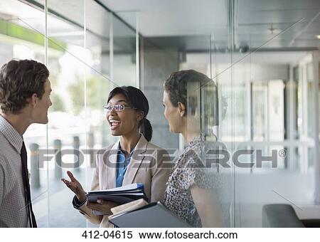 Stock Photography - Business people talking in office. Fotosearch