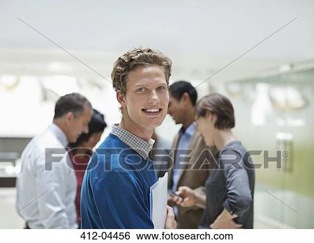 Businessman smiling in meeting View Large Photo Image Stock Photograph - Businessman smiling in meeting. Fotosearch