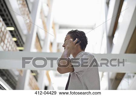 Businessman talking on cell phone View Large Photo Image Stock Photo - Businessman talking on cell phone. Fotosearch