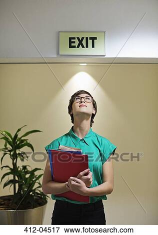 Businesswoman standing under office? exit? sig View Large Photo Image Stock Photo - Businesswoman standing under office? exit? sig. Fotosearch