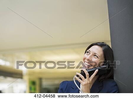 Businesswoman talking on phone View Large Photo Image Stock Photo - Businesswoman talking on phone. Fotosearch
