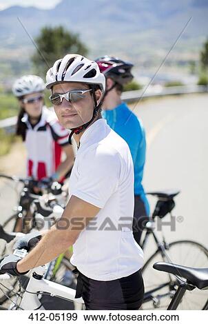 Cyclist smiling before race View Large Photo Image Stock Photo - Cyclist smiling before race. Fotosearch