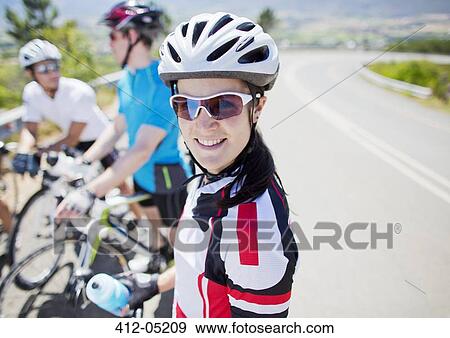 Stock Photo - Cyclist smiling before race. Fotosearch