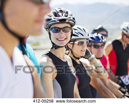 Stock Photo - Cyclist smiling before race. Fotosearch