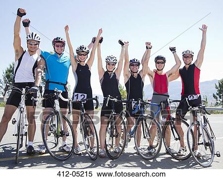 Cyclists cheering together on rural road View Large Photo Image Stock Photography - Cyclists cheering together on rural road. Fotosearch
