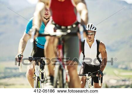Cyclists in race in rural landscape View Large Photo Image Stock Photograph - Cyclists in race in rural landscape. Fotosearch