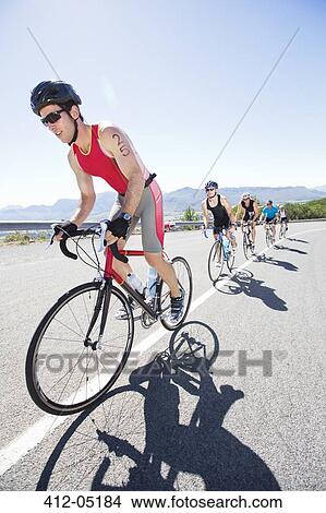 Cyclists in race on rural road View Large Photo Image Picture - Cyclists in race on rural road. Fotosearch