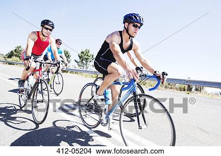 Cyclists in race on rural road View Large Photo Image Picture - Cyclists in race on rural road. Fotosearch