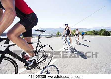 Stock Photo - Cyclists in race on rural road. Fotosearch