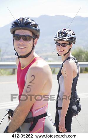 Cyclists smiling before race View Large Photo Image Stock Image - Cyclists smiling before race. Fotosearch