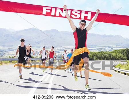 Runner crossing race finish line View Large Photo Image Stock Image - Runner crossing race finish line. Fotosearch