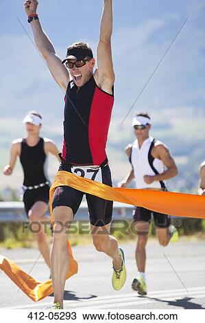 Runner crossing race finish line View Large Photo Image Stock Image - Runner crossing race finish line. Fotosearch