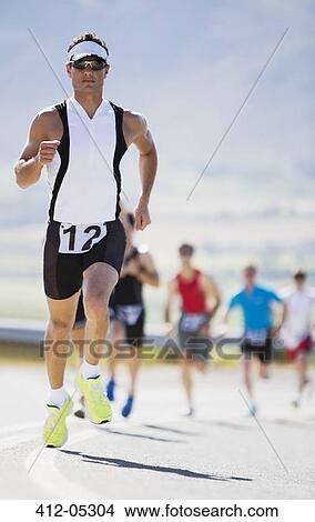 Runner in race on rural road View Large Photo Image Picture - Runner in race on rural road. Fotosearch