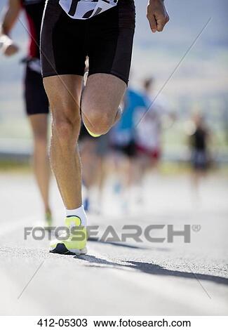Runner in race on rural road View Large Photo Image Stock Image - Runner in race on rural road. Fotosearch