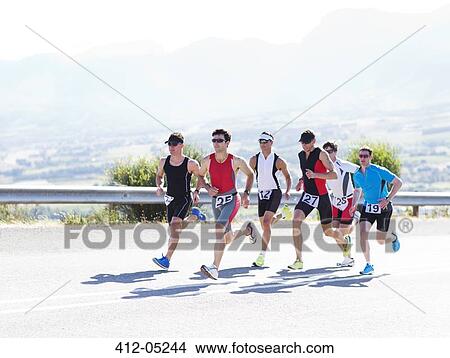 Runners in race on rural road View Large Photo Image Picture - Runners in race on rural road. Fotosearch