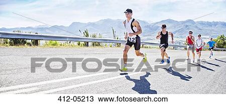 Stock Image - Runners in race on rural road. Fotosearch