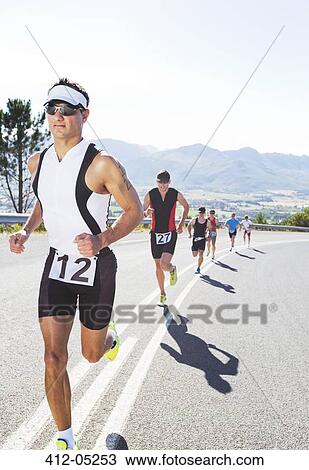 Runners in race on rural road View Large Photo Image Stock Image - Runners in race on rural road. Fotosearch