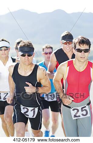 Runners in race on rural road View Large Photo Image Stock Photo - Runners in race on rural road. Fotosearch