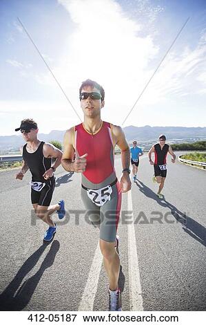 Stock Photo - Runners in race on rural road. Fotosearch