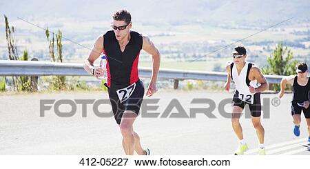Stock Photo - Runners in race on rural road. Fotosearch