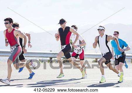 Runners in race on rural road View Large Photo Image Stock Photo - Runners in race on rural road. Fotosearch