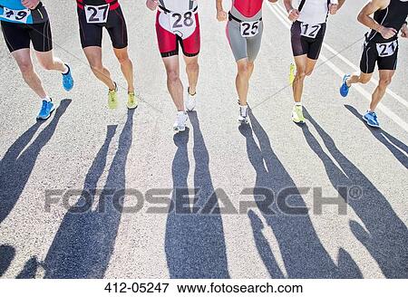Runners in race on rural road View Large Photo Image Stock Photo - Runners in race on rural road. Fotosearch