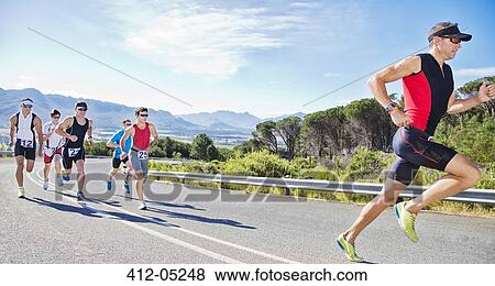 Runners in race on rural road View Large Photo Image Stock Photo - Runners in race on rural road. Fotosearch