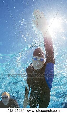 Triathlete in wetsuit underwater View Large Photo Image Picture - Triathlete in wetsuit underwater. Fotosearch