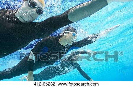 Triathletes in wetsuits underwater View Large Photo Image Stock Image - Triathletes in wetsuits underwater. Fotosearch