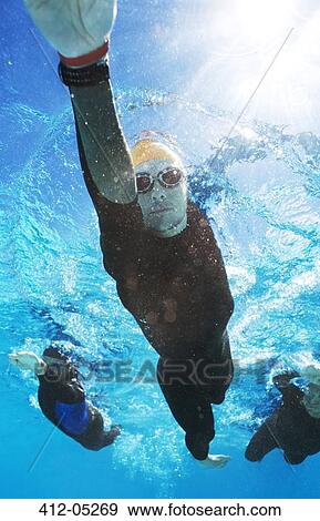 Triathletes in wetsuits underwater View Large Photo Image Stock Photo - Triathletes in wetsuits underwater. Fotosearch