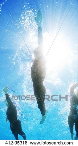Triathletes in wetsuits underwater View Large Photo Image Stock Photograph - Triathletes in wetsuits underwater. Fotosearch