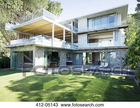 Stock Image - Backyard of modern house. Fotosearch