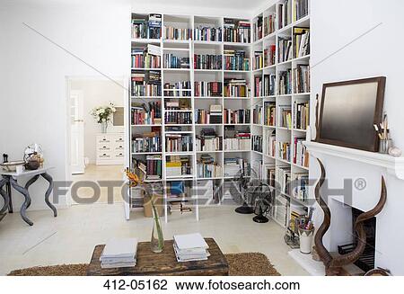 Bookshelves and fireplace in modern living room View Large Photo Image Stock Image - Bookshelves and fireplace in modern living room. Fotosearch