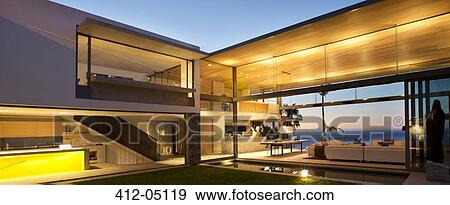 Illuminated patio of modern house View Large Photo Image Stock Photo - Illuminated patio of modern house. Fotosearch