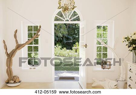 Open front door of modern house Stock Photo | 412-05159 | Fotosearch