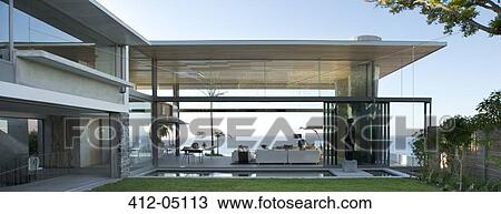 Patio and swimming pool of modern house View Large Photo Image Stock Image - Patio and swimming pool of modern house. Fotosearch