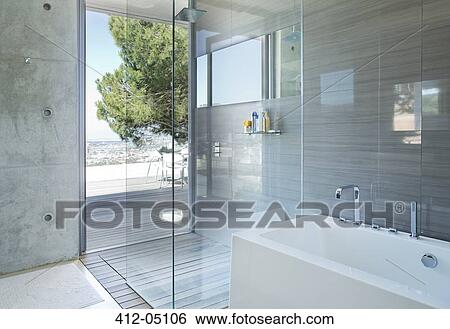 Stock Photograph - Shower and bath in modern bathroom. Fotosearch