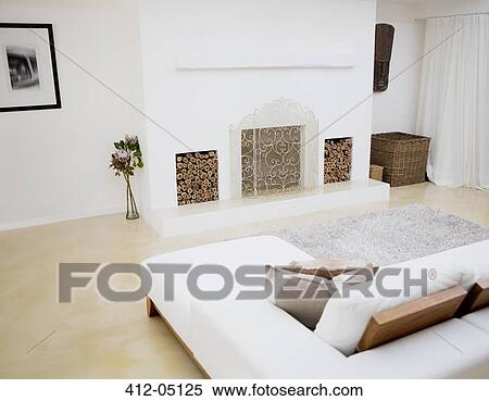 Stock Photography - Sofa and fireplace in modern living room. Fotosearch