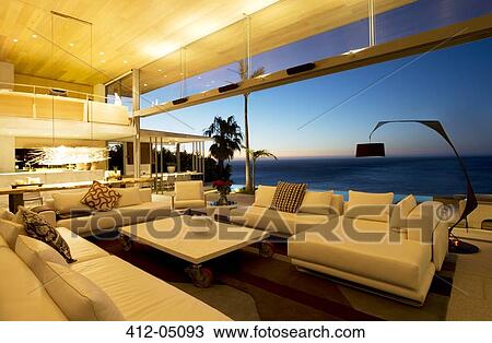 Stock Image - Sofas and table in modern living room. Fotosearch