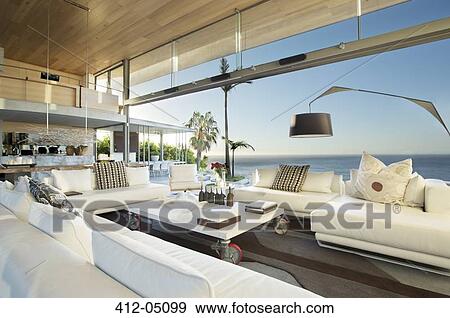 Stock Photo - Sofas and table in modern living room. Fotosearch