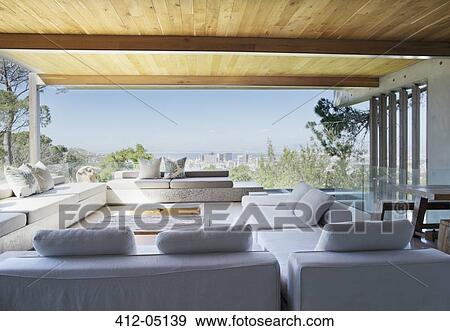 Stock Photo - Sofas and table in modern living room. Fotosearch