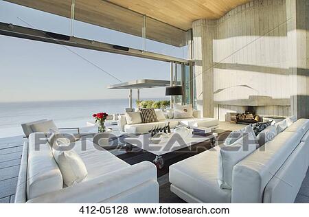 Stock Photo - Sofas and table on modern patio. Fotosearch