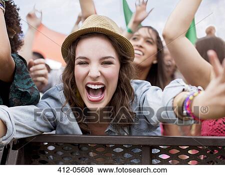 Close up of cheering woman at music festival View Large Photo Image Stock Photo - Close up of cheering woman at music festival. Fotosearch