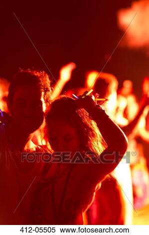 Couple dancing at music festival View Large Photo Image Stock Photography - Couple dancing at music festival. Fotosearch