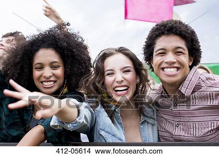 Enthusiastic friends at music festival View Large Photo Image Picture - Enthusiastic friends at music festival. Fotosearch