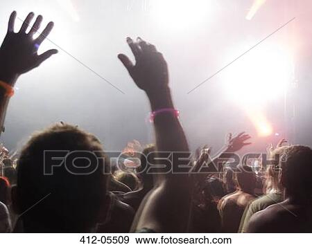 Stock Photo - Fans cheering at music festival. Fotosearch