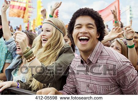 Fans cheering at music festival View Large Photo Image Stock Photo - Fans cheering at music festival. Fotosearch