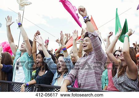 Fans cheering at music festival View Large Photo Image Stock Photo - Fans cheering at music festival. Fotosearch