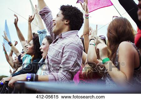 Fans cheering at music festival View Large Photo Image Stock Photography - Fans cheering at music festival. Fotosearch