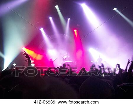 Fans cheering for performers on stage at music festival View Large Photo Image Stock Photography - Fans cheering for performers on stage at music festival. Fotosearch